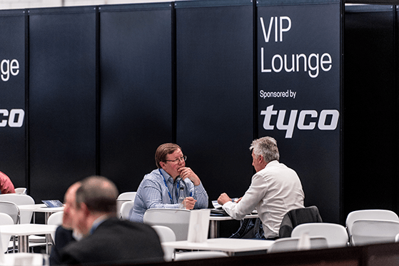 An exhibitor meeting with a potential client